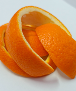 Pile of orange peels on a white background