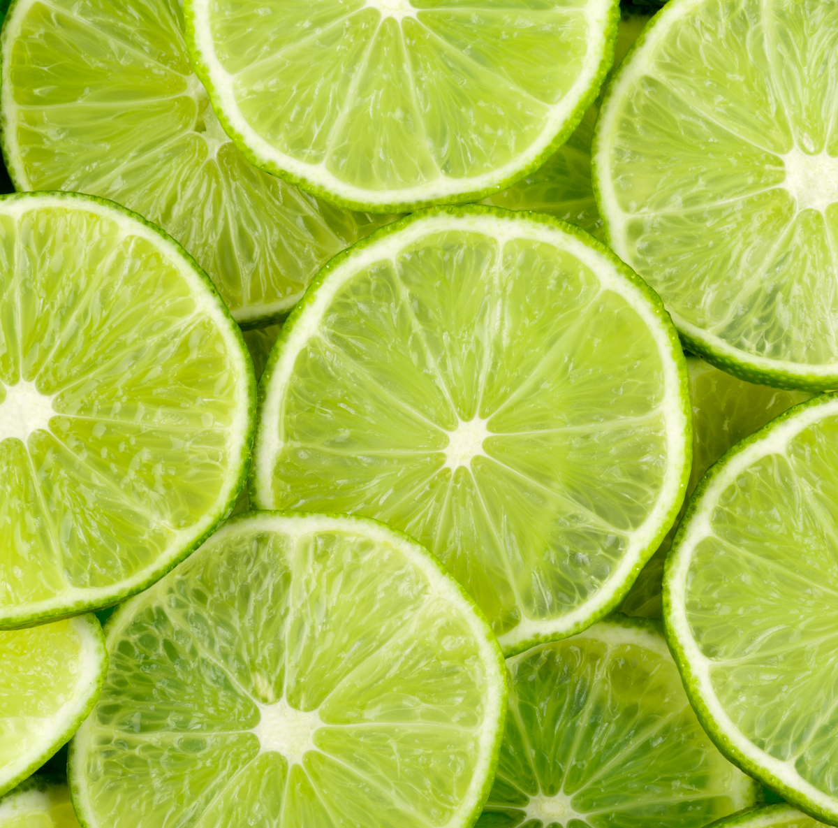 Close-up of sliced limes with a vibrant green color.