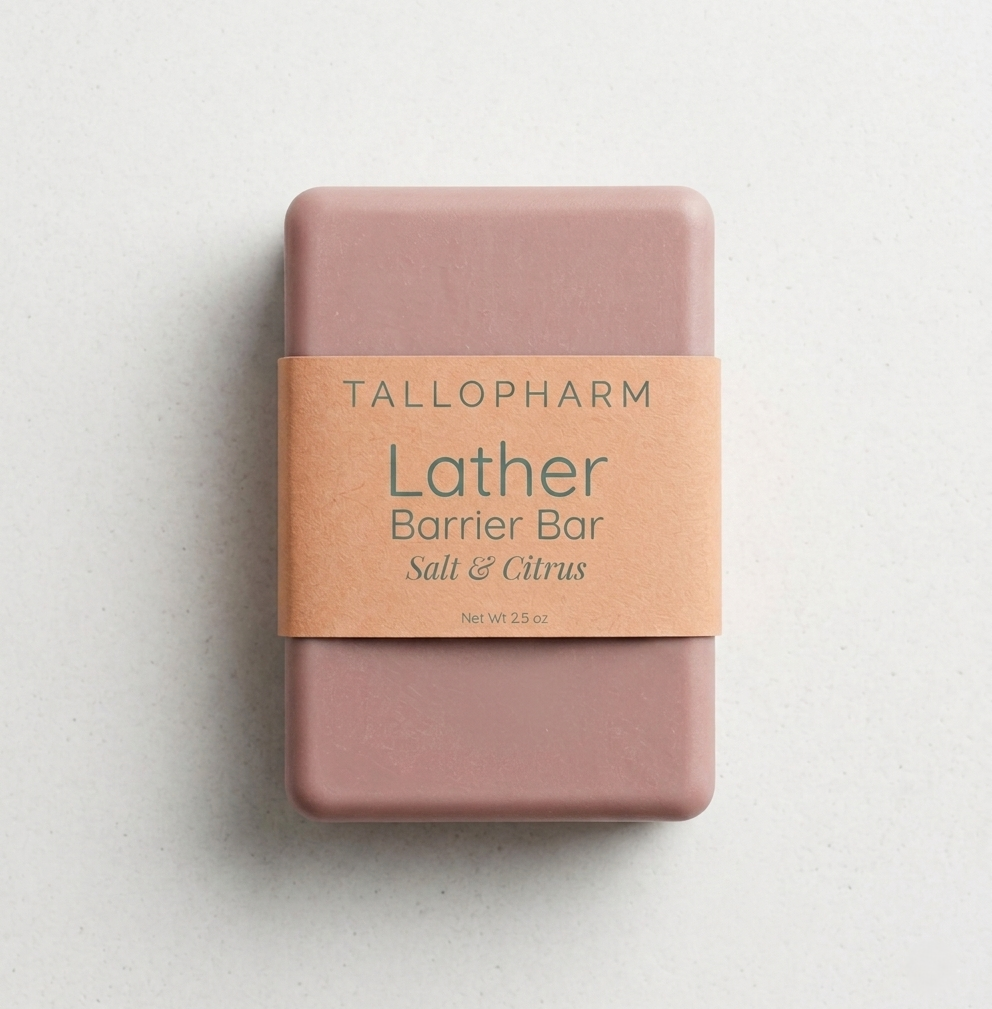 Pink soap bar with a blush label on a light gray background