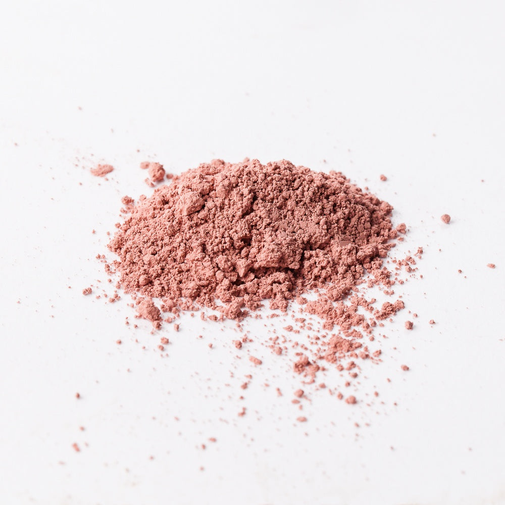 Pink powder on a white background
