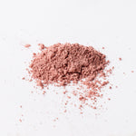 Pink powder on a white background
